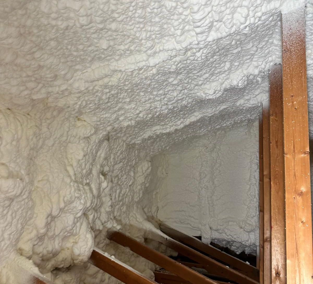 Spray foam insulation applied to an attic roof deck