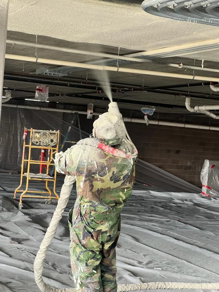 Spray foam applied between roof rafters on a project